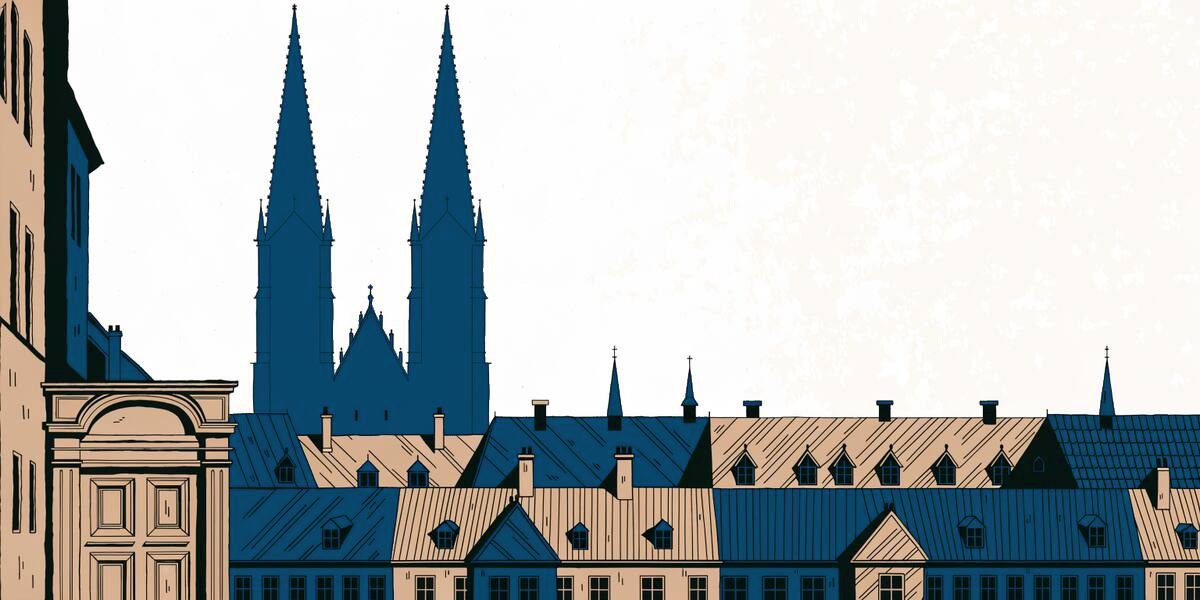Silhouette d'une cathédrale à deux flèches au-dessus des toits d'une vieille ville